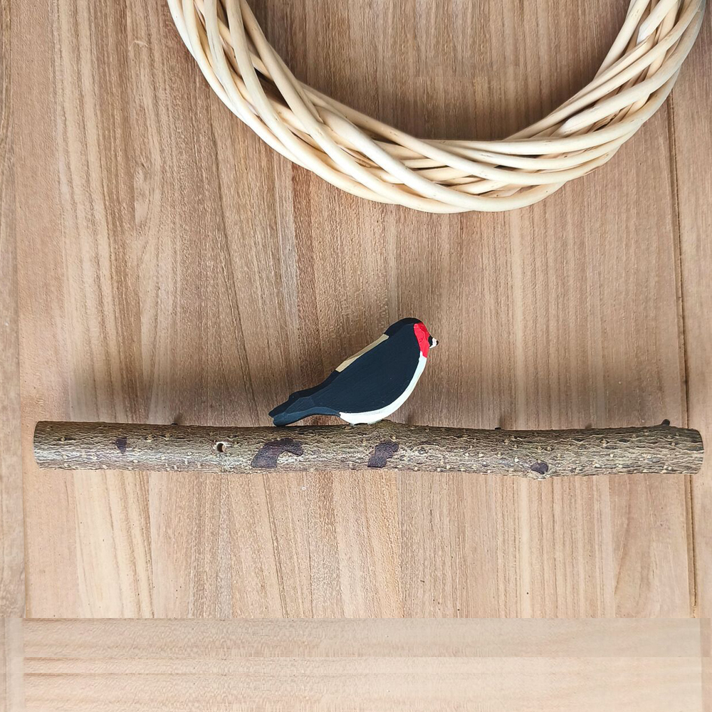 Oiseau Branche Chardonneret élégant de dos